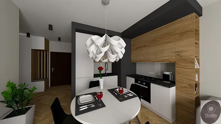 Nowoczesna kuchnia z czarnymi frontami i jadalnią z okrągłym stołem