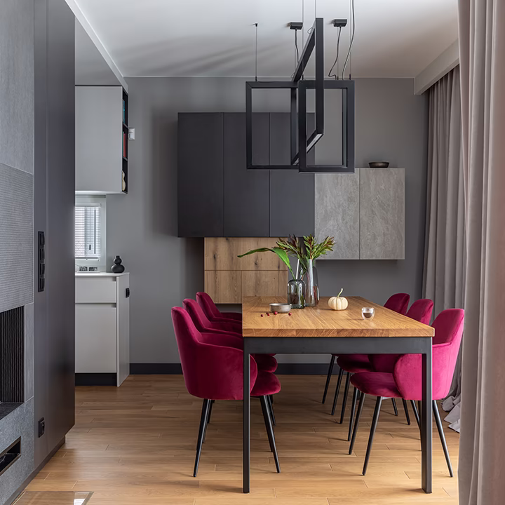 Nowoczesna jadalnia – elegancka aranżacja wnętrza z funkcjonalnym stołem i designerskim oświetleniem