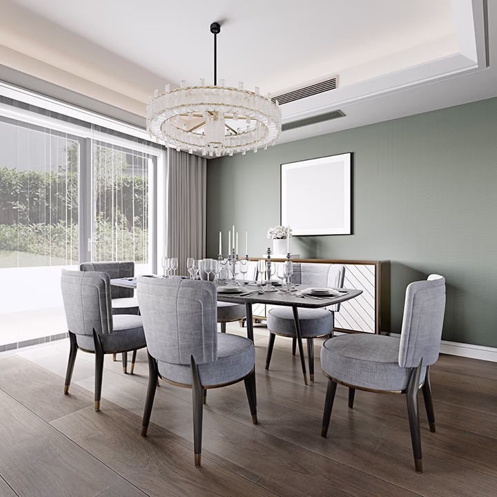 Nowoczesna jadalnia z szarymi krzesłami, szałwiową ścianą i kryształowym żyrandolem